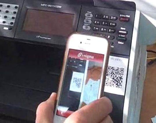 QR code attached to a printer, viewed on a mobile device.